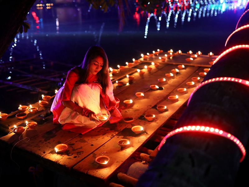 10 01 Diwali with girl lighting lights